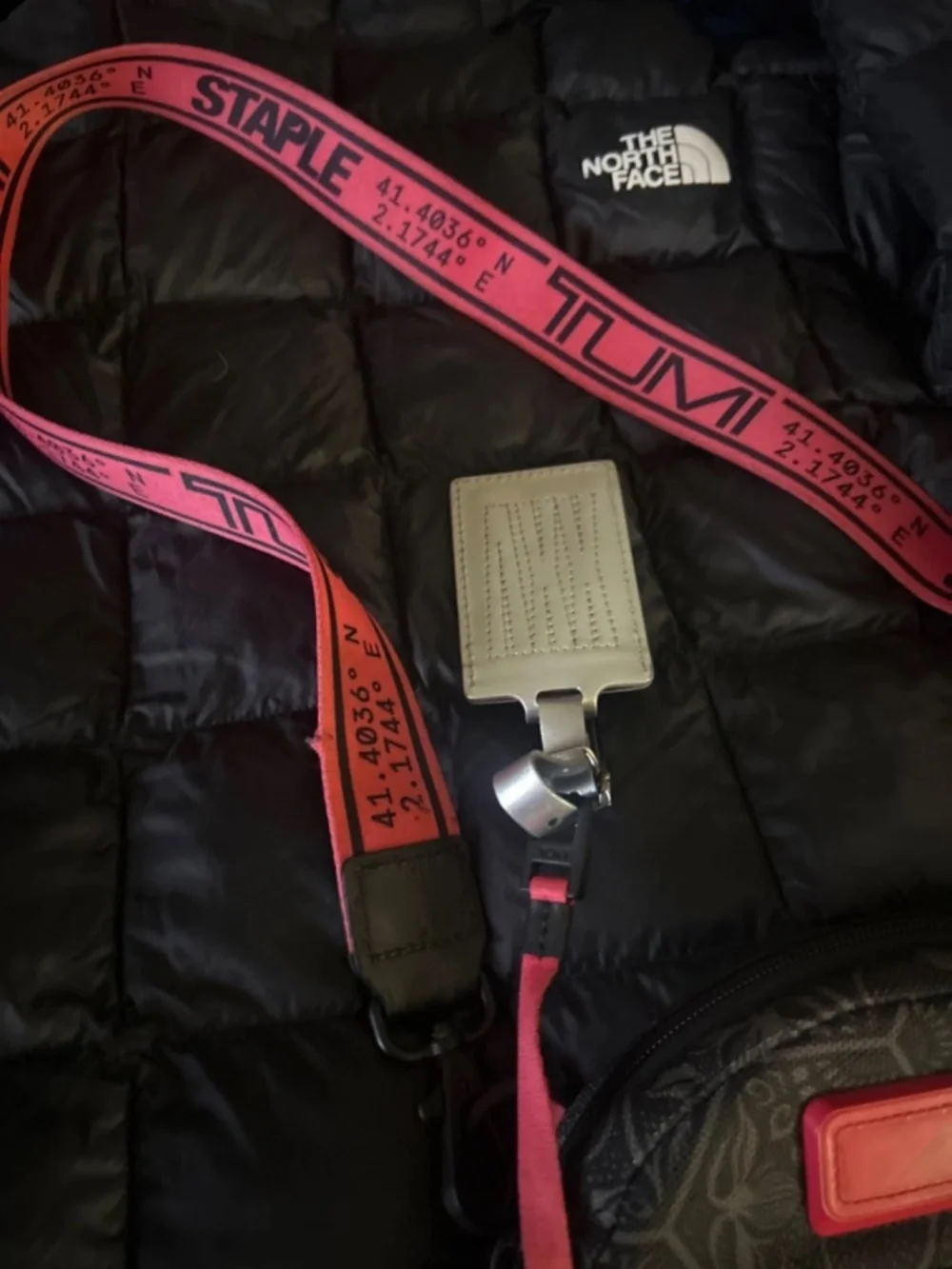 Unisex Black and Red Tumi staple crossbody